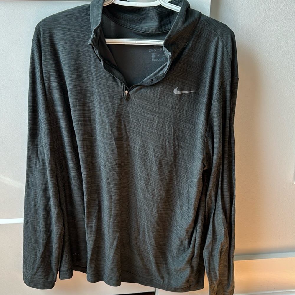 Nike. Black & gray, striped, half zipped pullover.